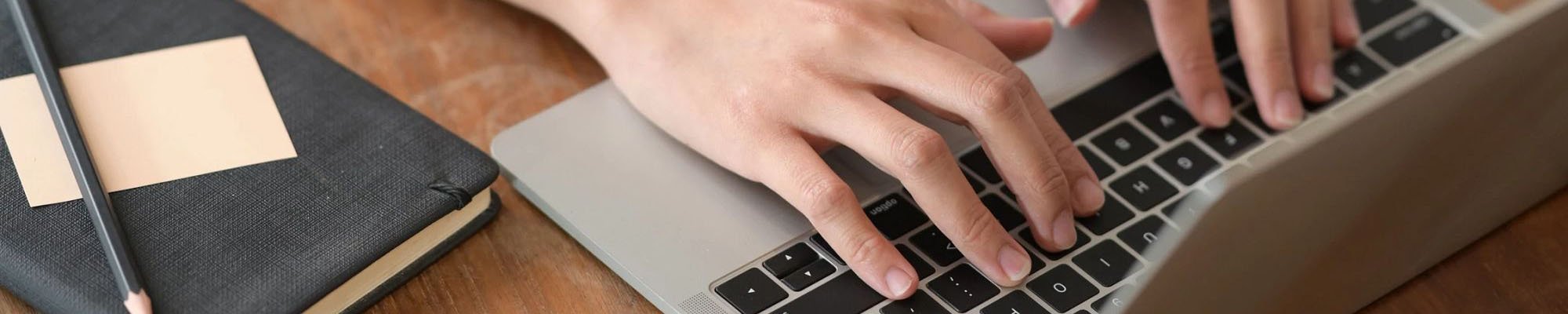 Man typing on keyboard - Keystone Carpets Inc